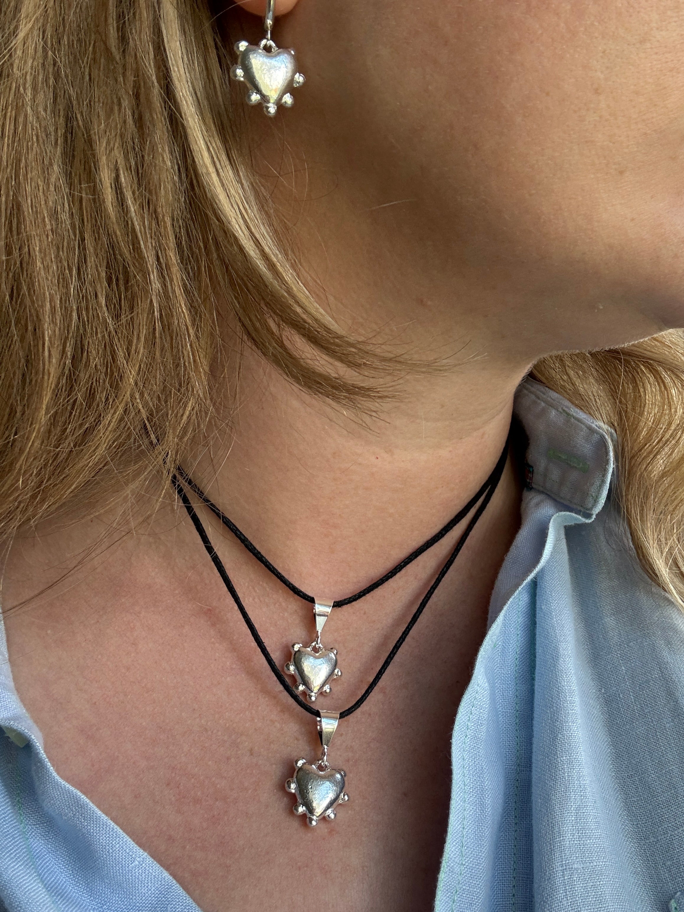 Thick sterling silver heart bordered with dots. This heart is a casting from an original mold that I created out of wax.