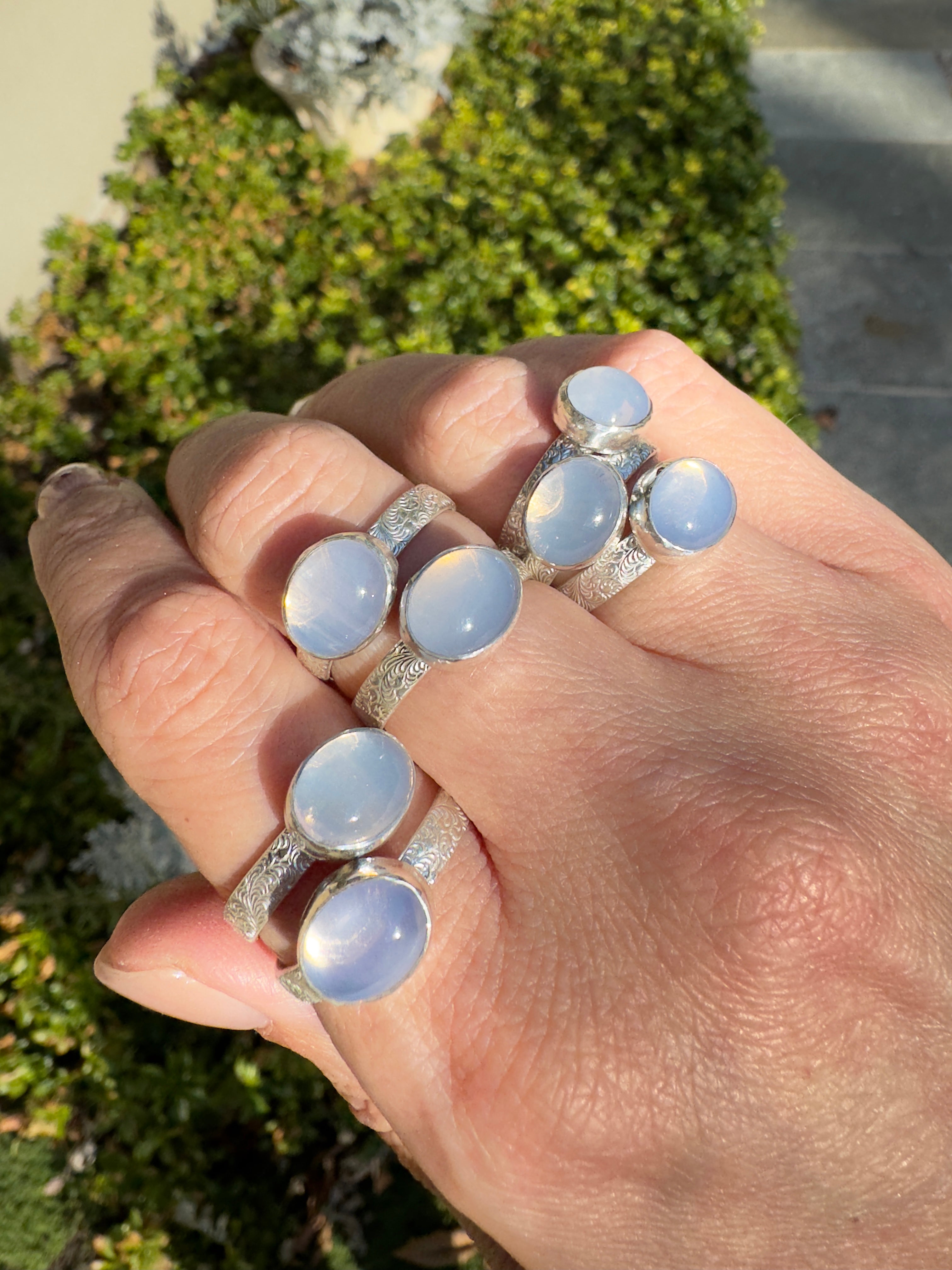 Sparkling lavender moon quartz on shiny sterling silver patterned bands