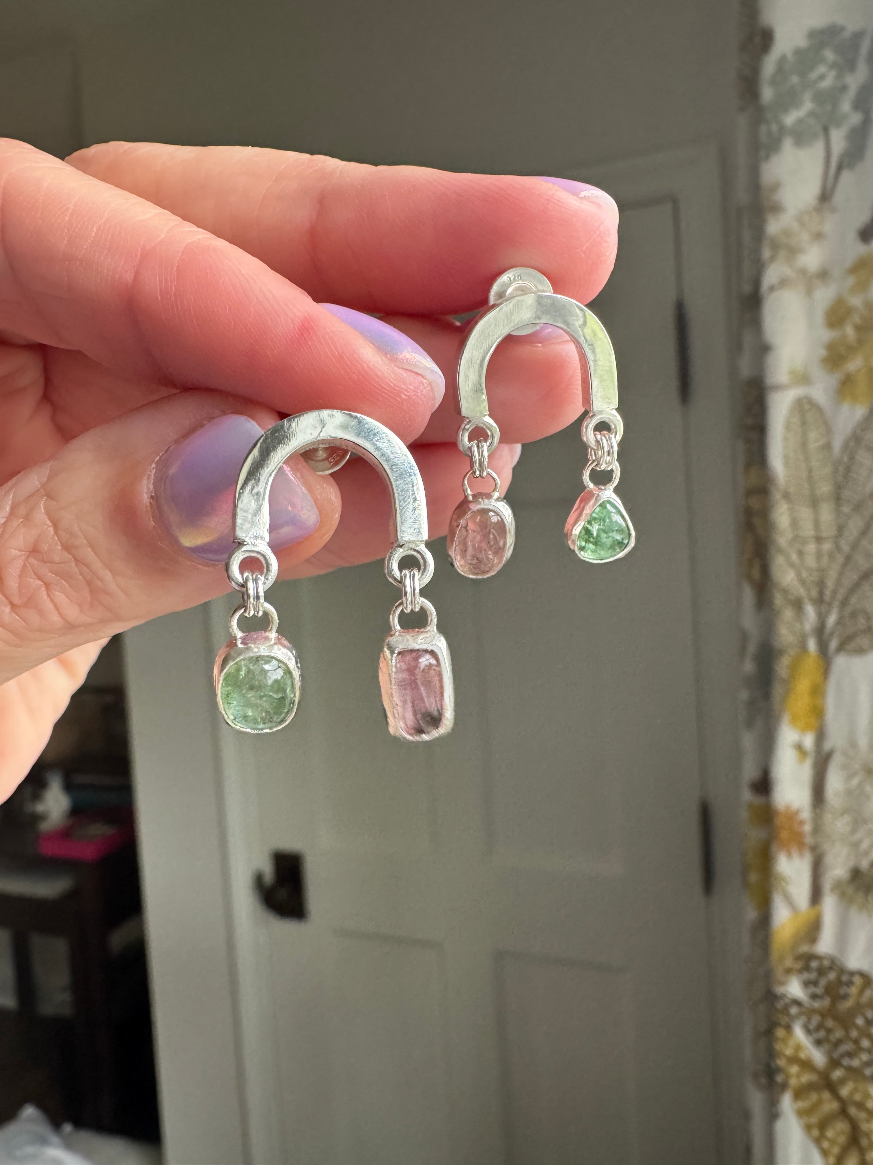 Sterling silver rainbow shaped earring with beautiful pink and green tourmaline.
