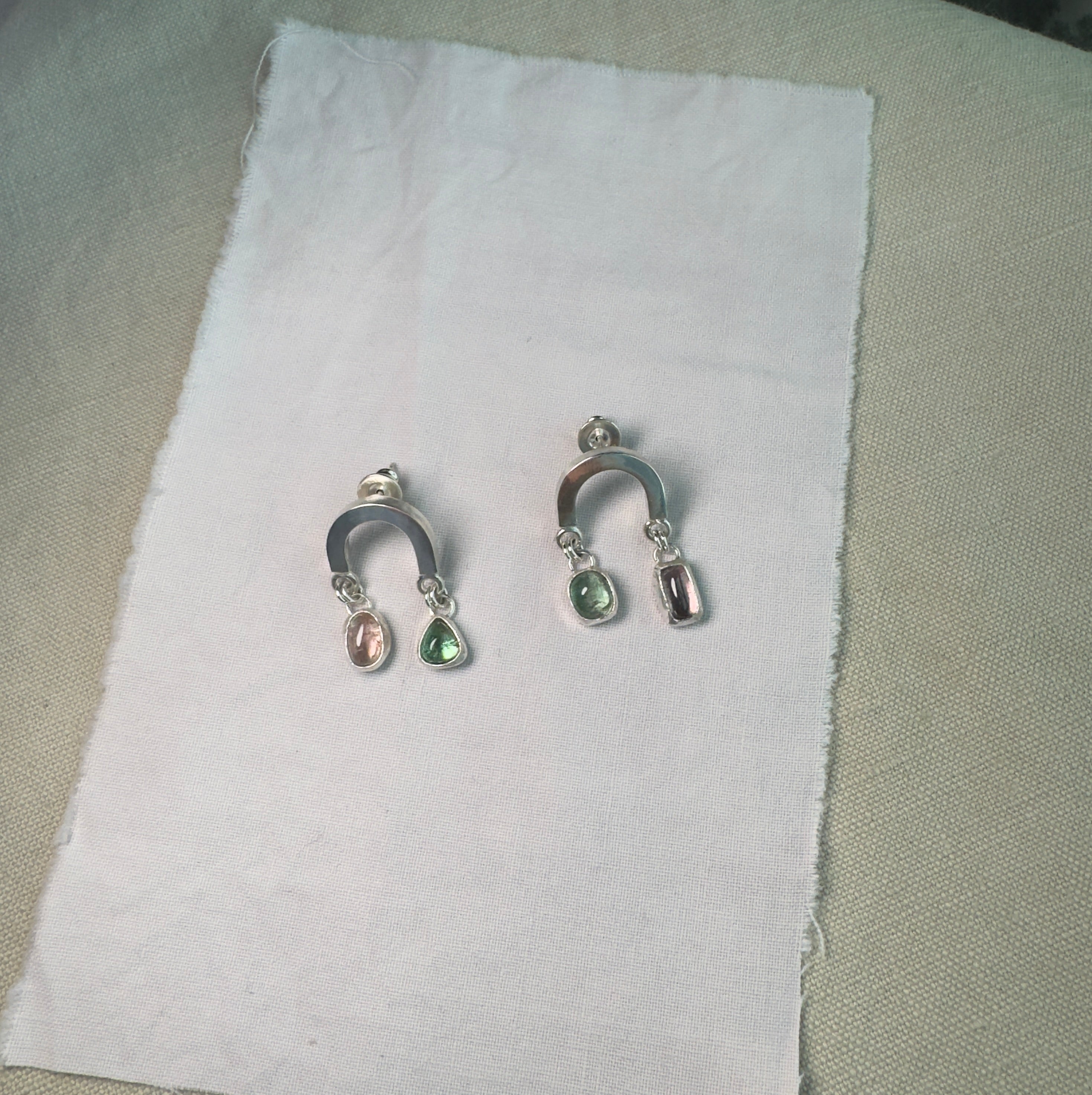 Sterling silver rainbow shaped earring with beautiful pink and green tourmaline.