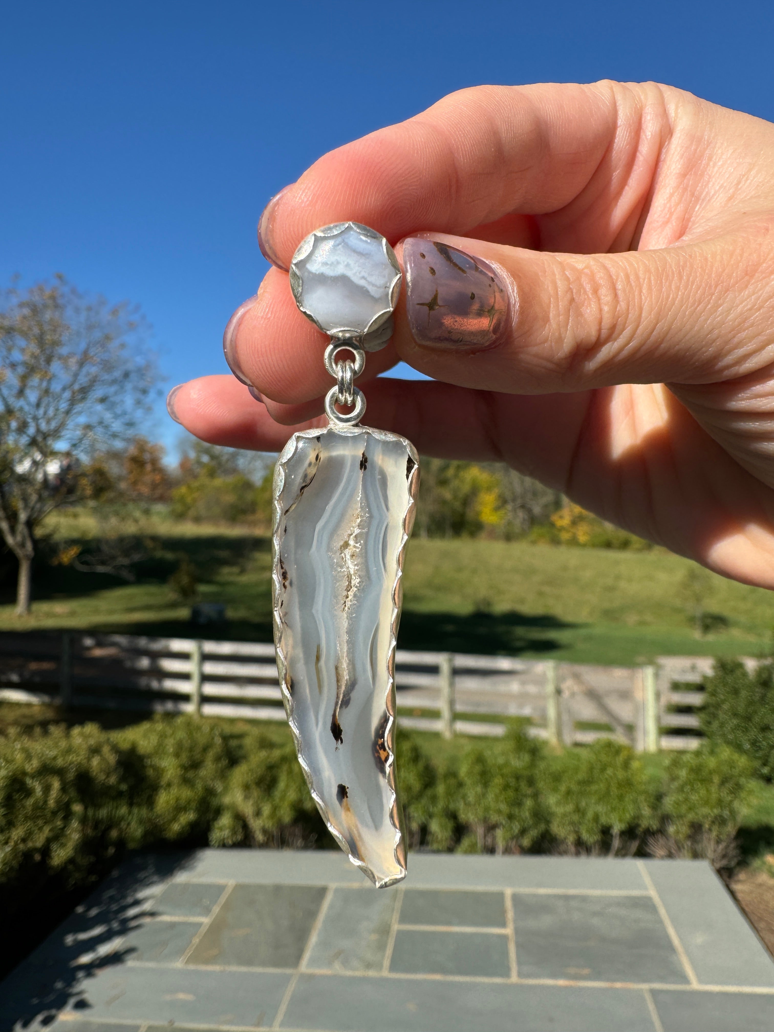 Gorgeous Montana Yellowstone Agate wrapped in fine silver and dangling from periwinkle chalcedony studs. This Montana agate was dug and cut by a Montana born female miner, making this pair extra special. These look stunning on, especially when the light hits the agate because I cut out most of the silver in the back to allow light to shine through and also keep these very lightweight and easy to wear. One of a kind pair.