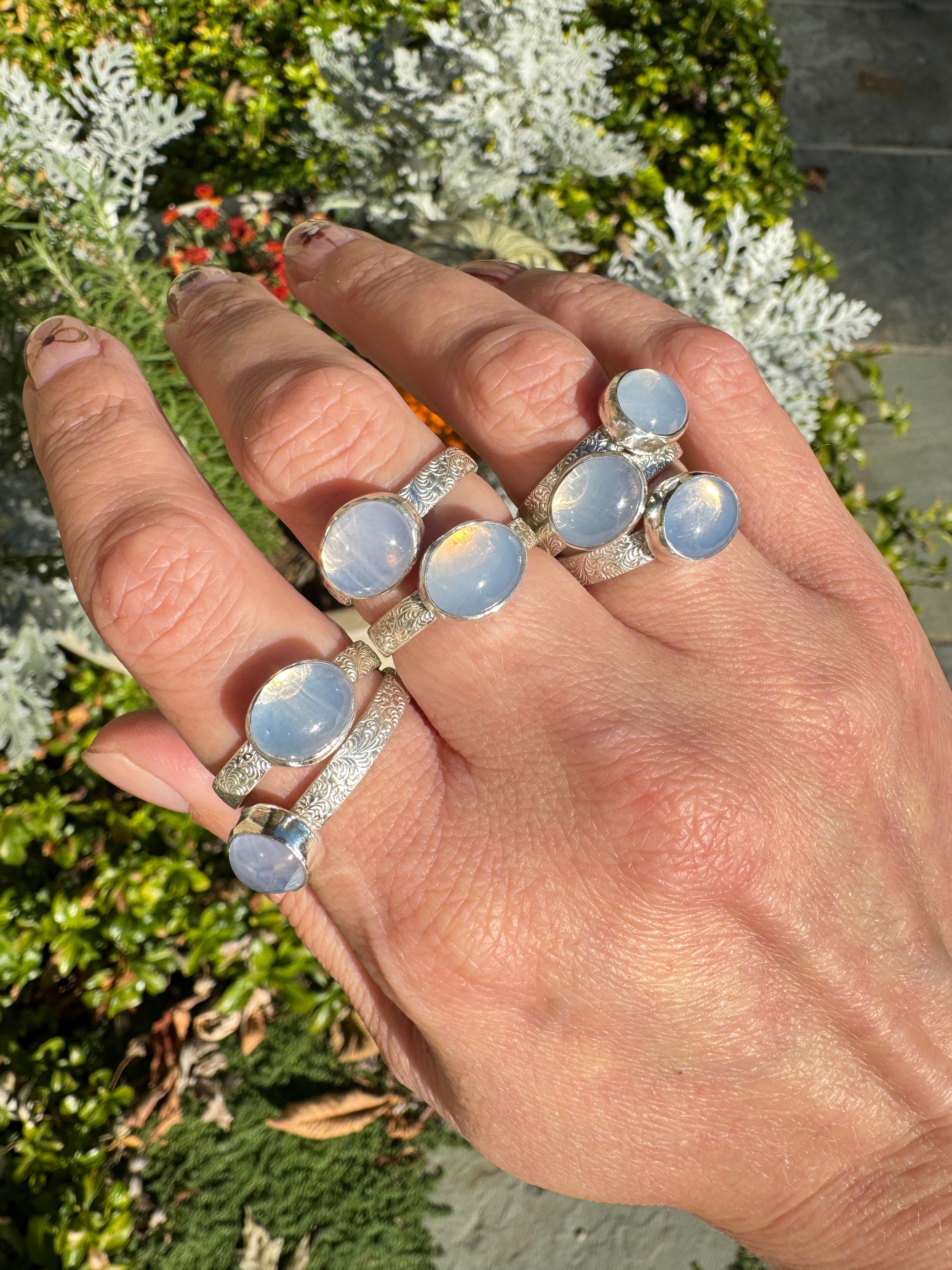 Sparkling lavender moon quartz on shiny sterling silver patterned bands