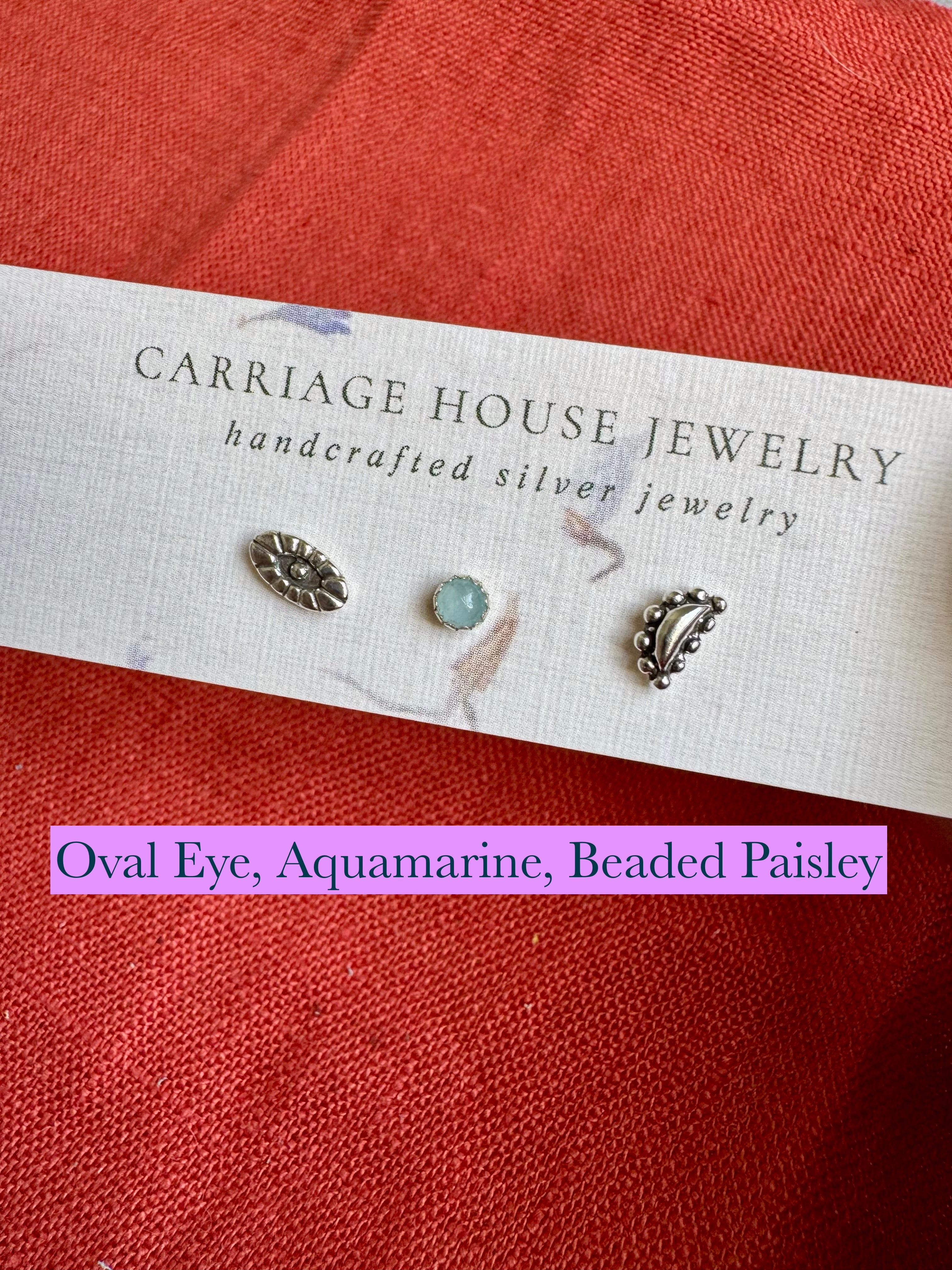 Sterling silver oval eye, aquamarine, and beaded paisley-type mixed stud earrings
