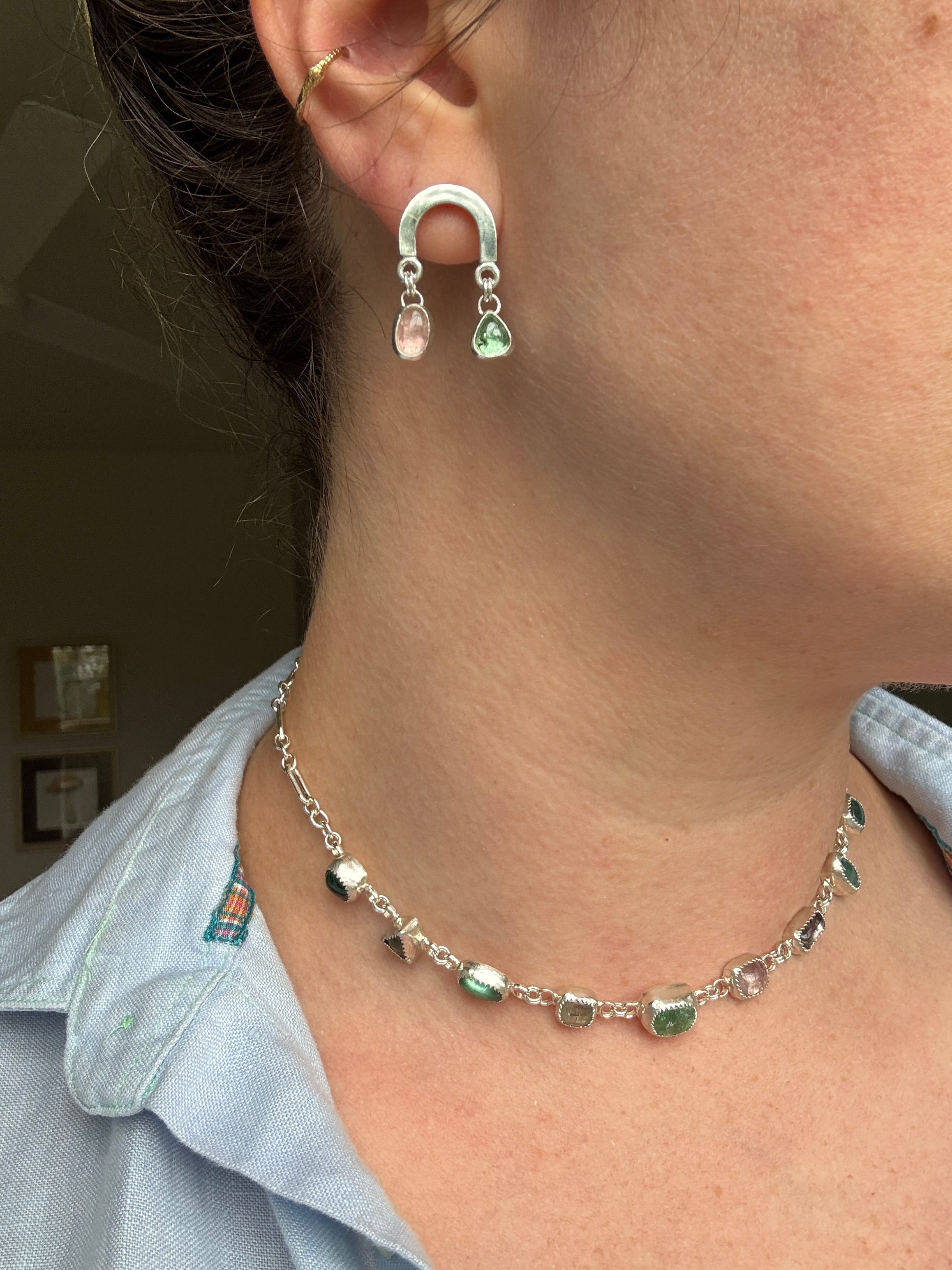 Sterling silver rainbow shaped earring with beautiful pink and green tourmaline.