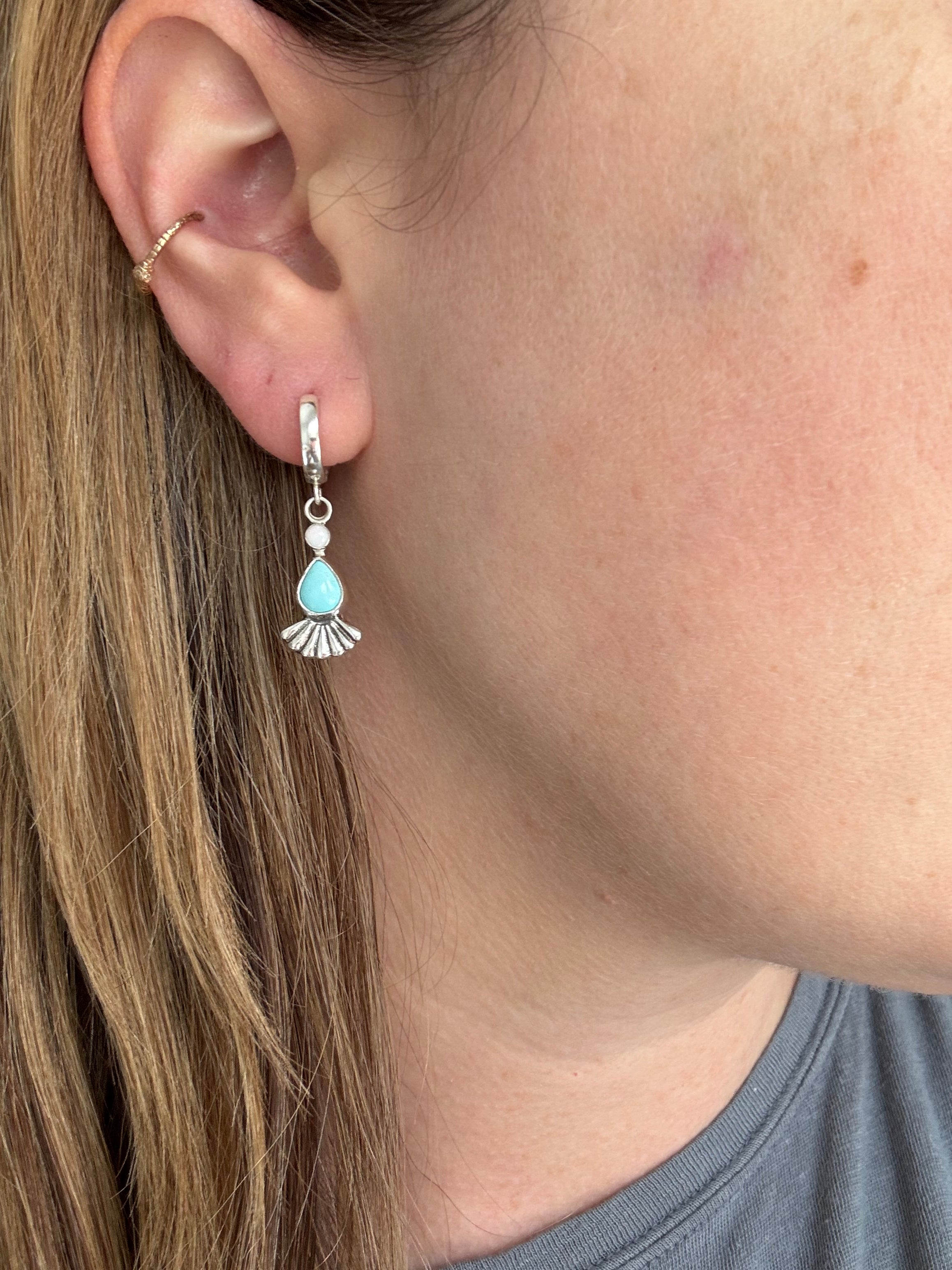Sterling silver huggie hoops with turquoise, opal, and a sterling silver fan accent